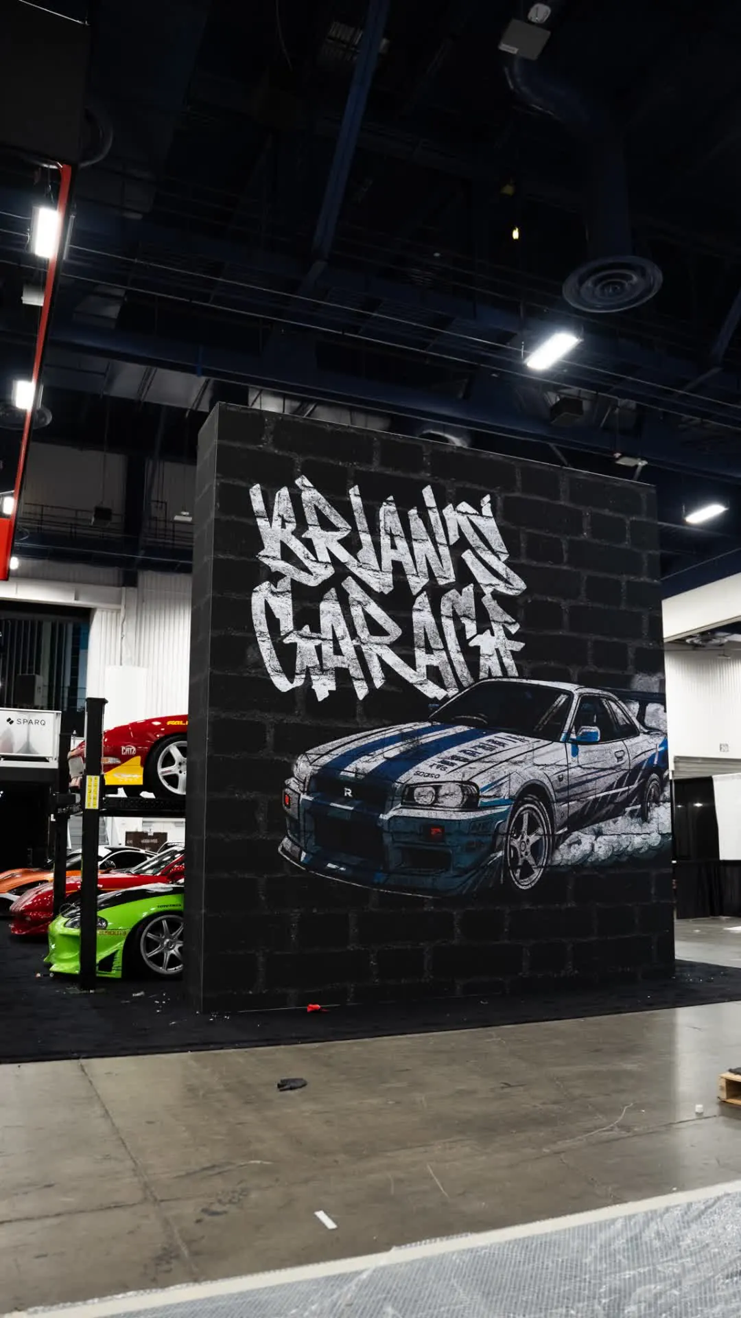 Brian's Garage — Skyline GT-R wall, Eclipse on the lift