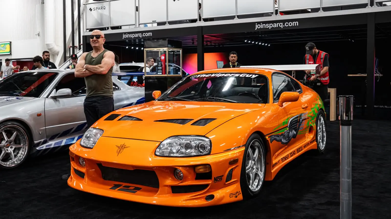 Brian's MKIV — The orange Supra, parked in the booth