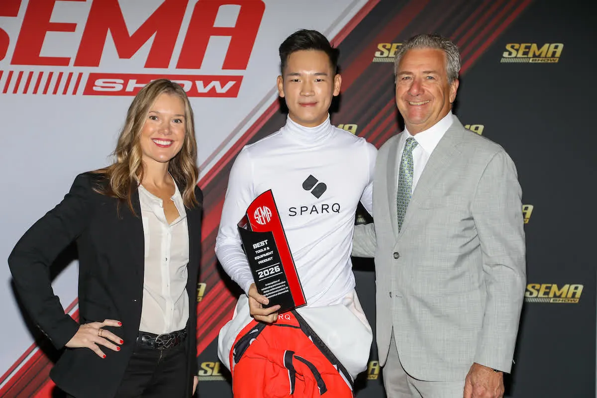 On the Podium — The trophy, handed off